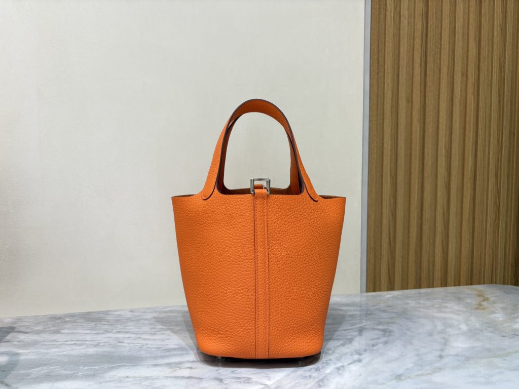 Orange Picotin Lock with central leather strap and padlock, front view