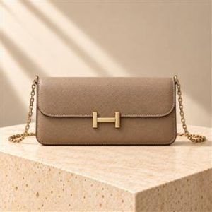 Constance To Go handbag on warm ivory limestone