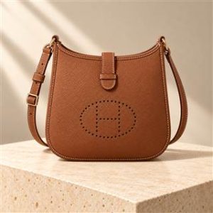 Evelyn Mini handbag on warm ivory limestone