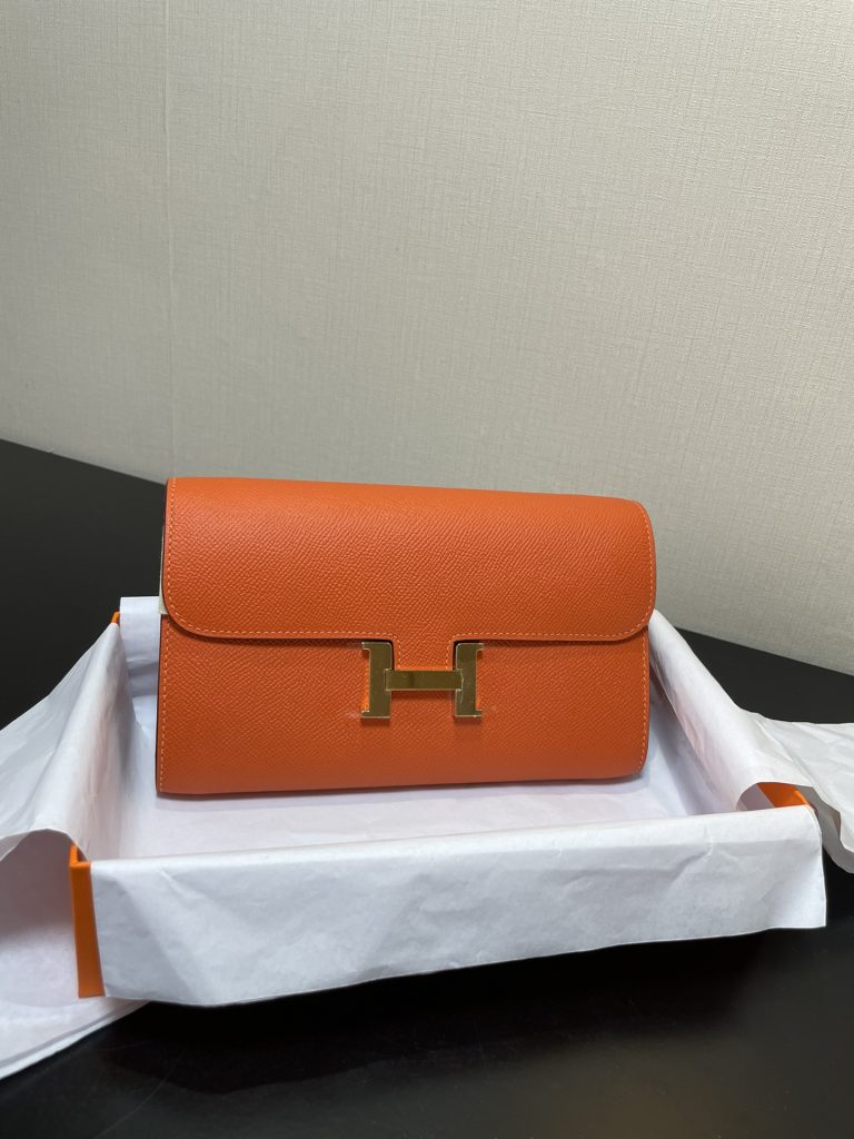 Constance To Go — 20.5 × 13 × 2 cm — Orange — Epsom leather — Gold-tone hardware
