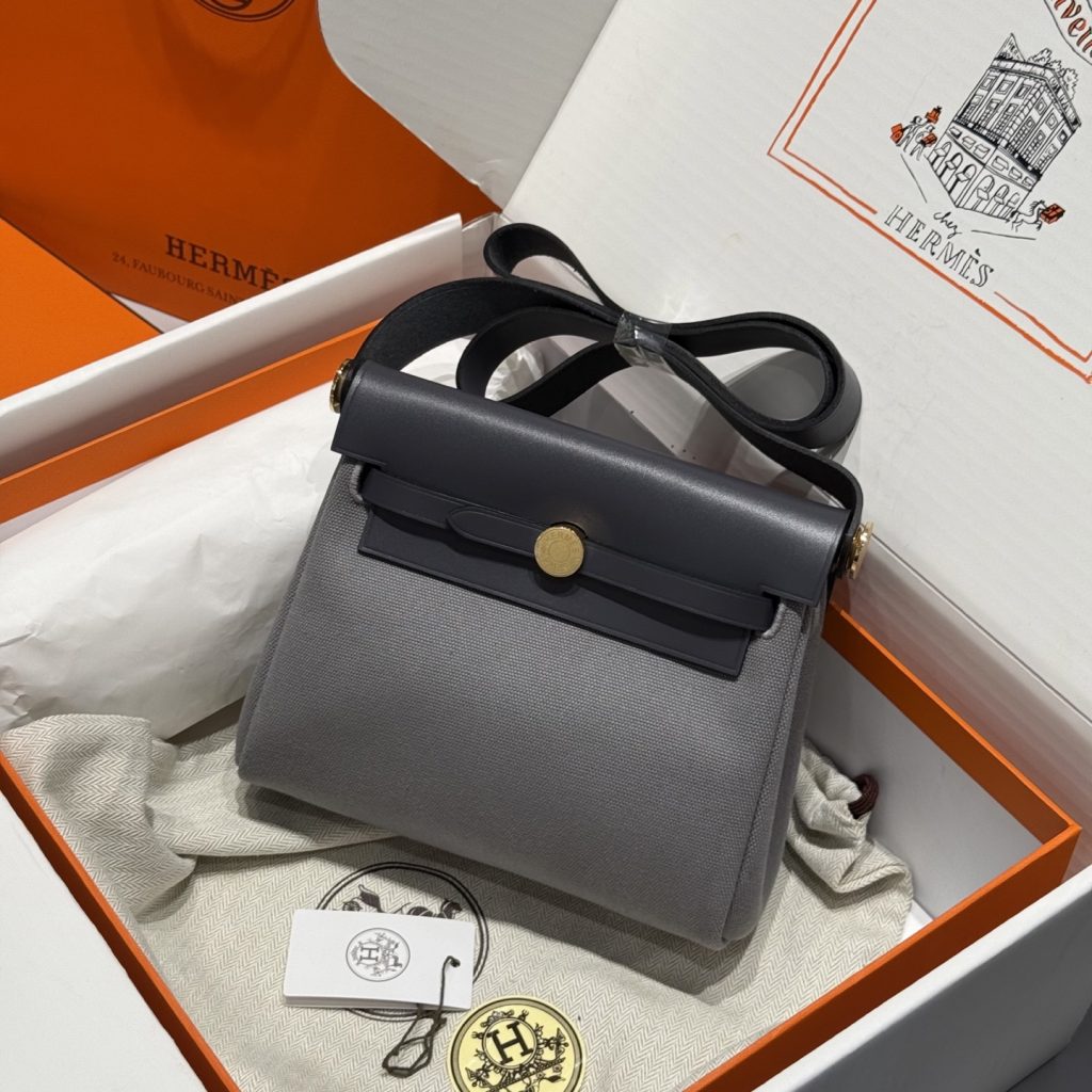 Mini Herbag — Slate Gray — a canvas body with leather trim — Gold-tone or silver-tone hardware