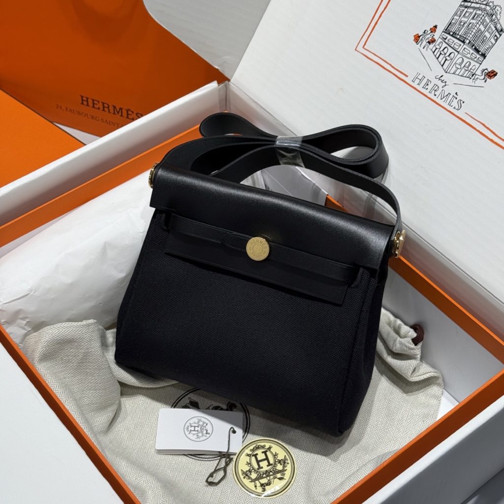 Mini Herbag — Black and Gold — a canvas body with leather trim — Gold-tone or silver-tone hardware