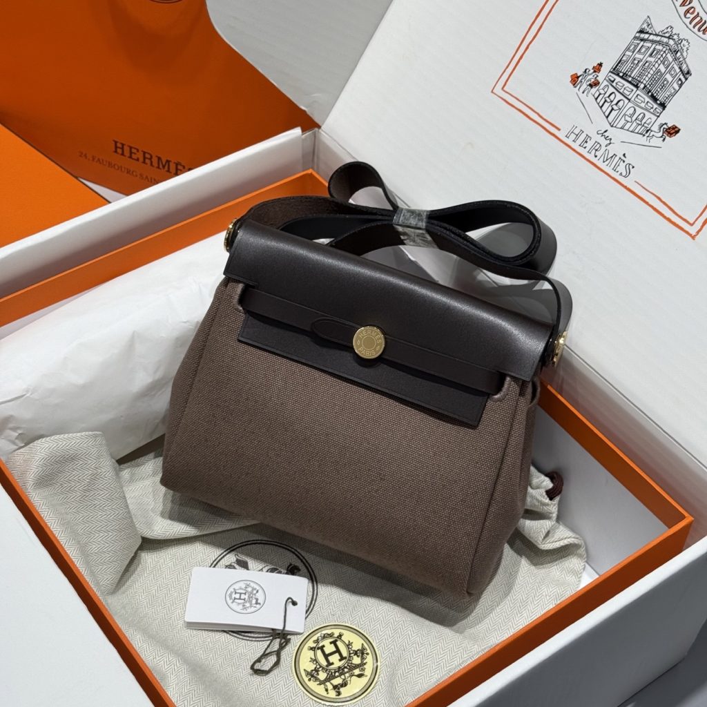 Mini Herbag — 20 cm — Ebony — a canvas body with leather trim — Gold-tone or silver-tone hardware