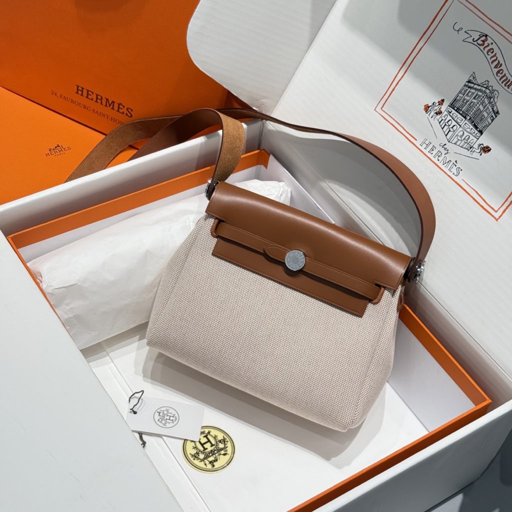 Mini Herbag — Golden Brown — a canvas body with leather trim — Gold-tone or silver-tone hardware