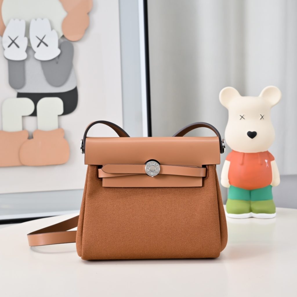 Mini Herbag — a canvas body with leather trim — Gold-tone or silver-tone hardware