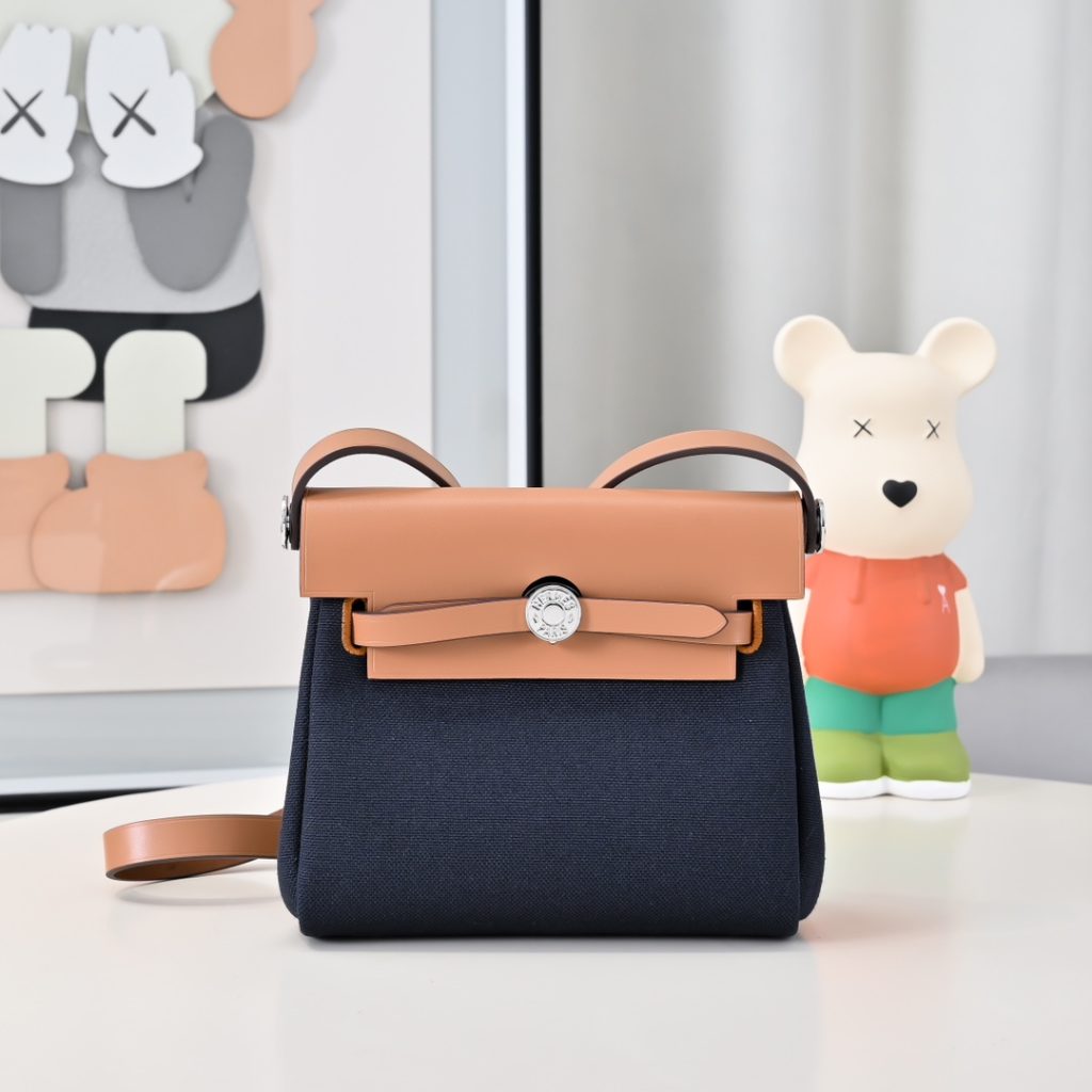 Mini Herbag — a canvas body with leather trim — Gold-tone or silver-tone hardware