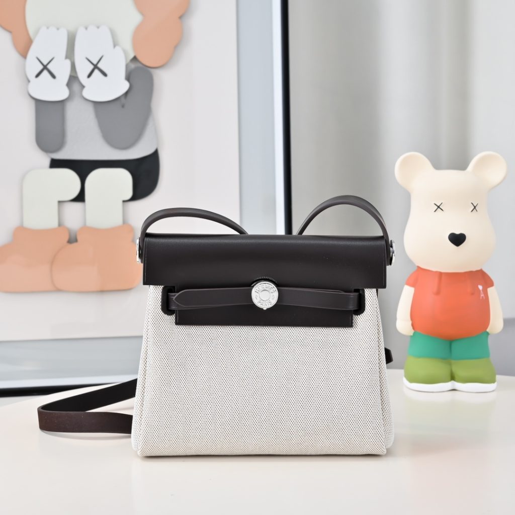 Mini Herbag — a canvas body with leather trim — Gold-tone or silver-tone hardware