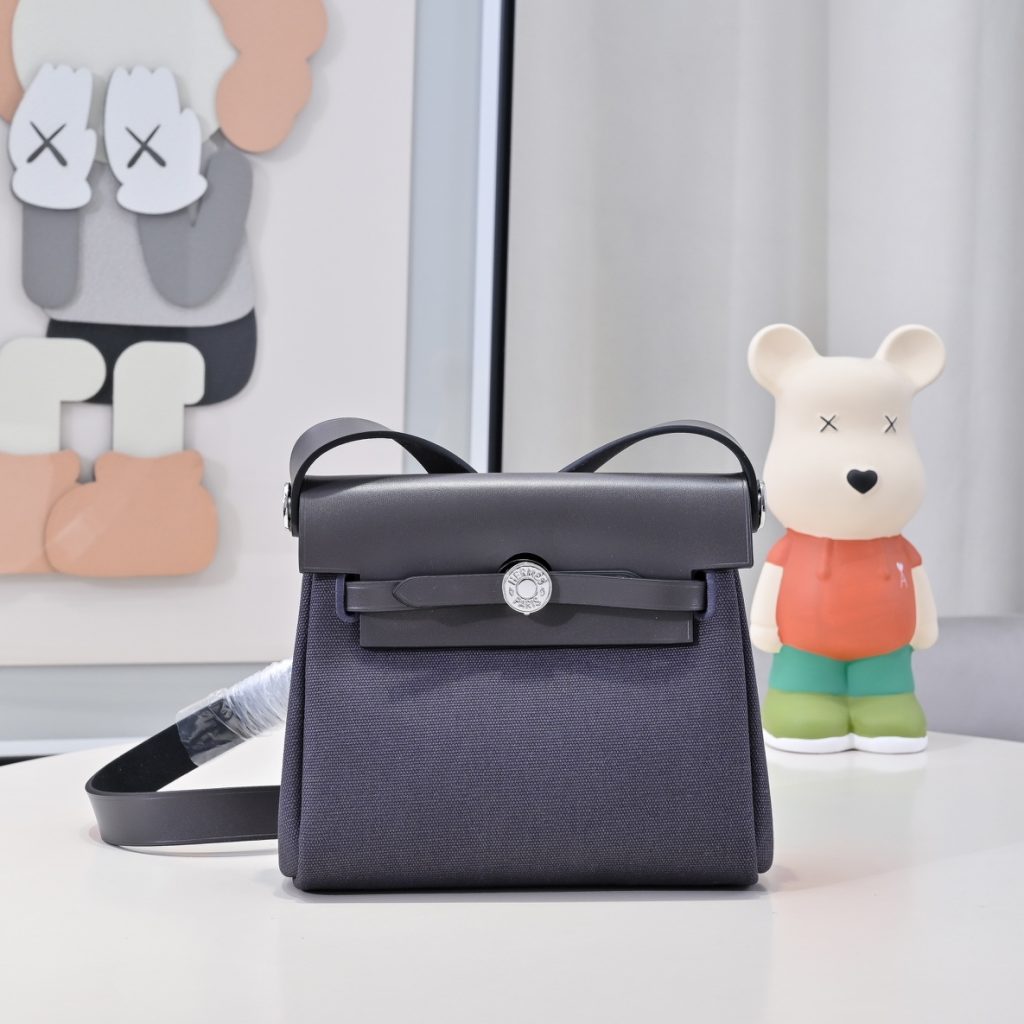 Mini Herbag — a canvas body with leather trim — Gold-tone or silver-tone hardware
