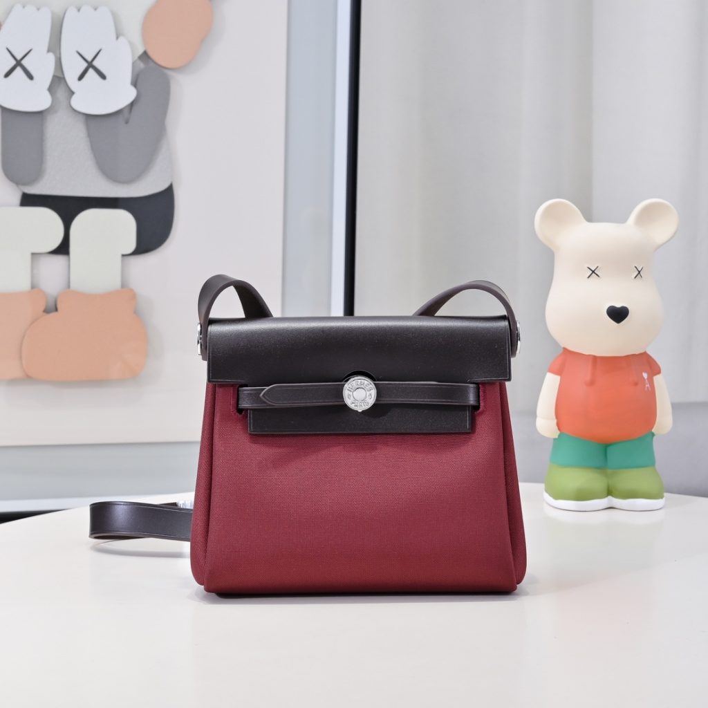 Mini Herbag — Burgundy — a canvas body with leather trim — Gold-tone or silver-tone hardware