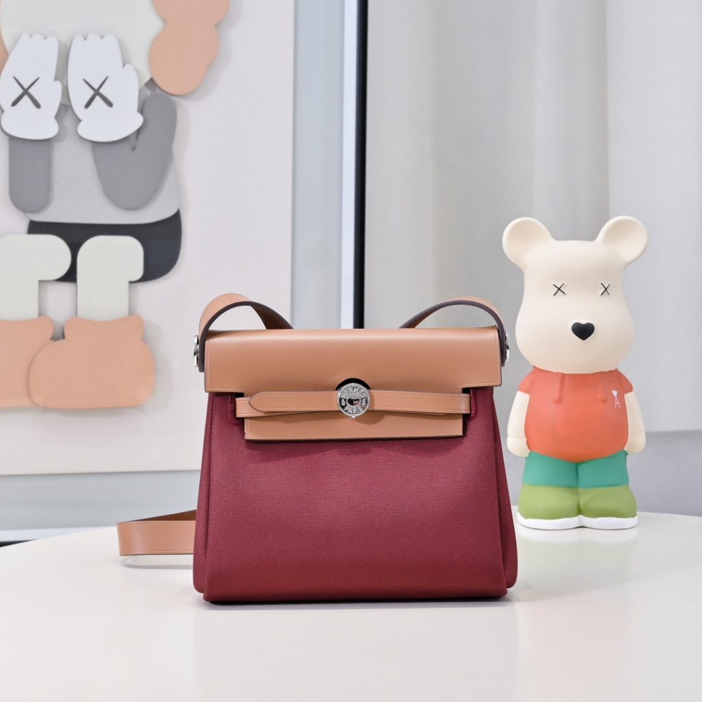 Mini Herbag — 20 cm — Burgundy — a canvas body with leather trim — Gold-tone or silver-tone hardware