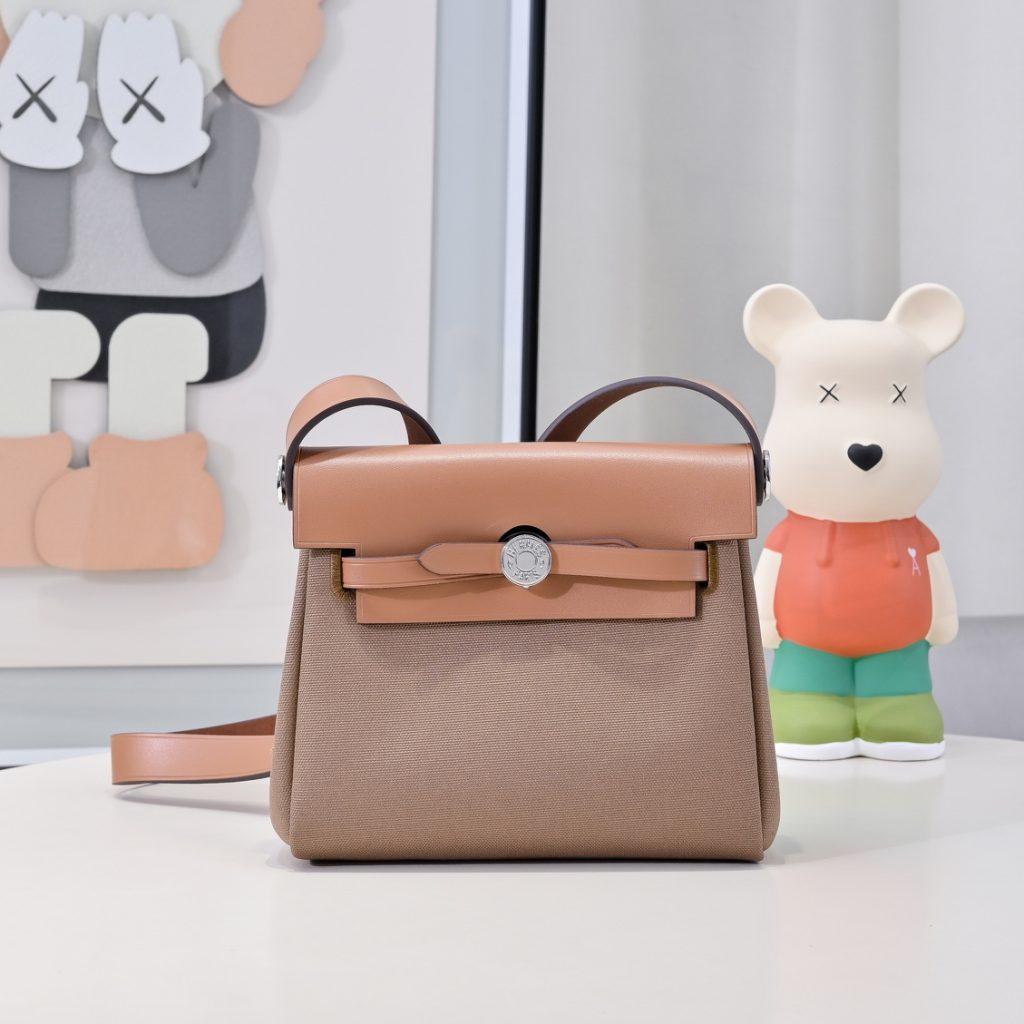 Mini Herbag — a canvas body with leather trim — Gold-tone or silver-tone hardware