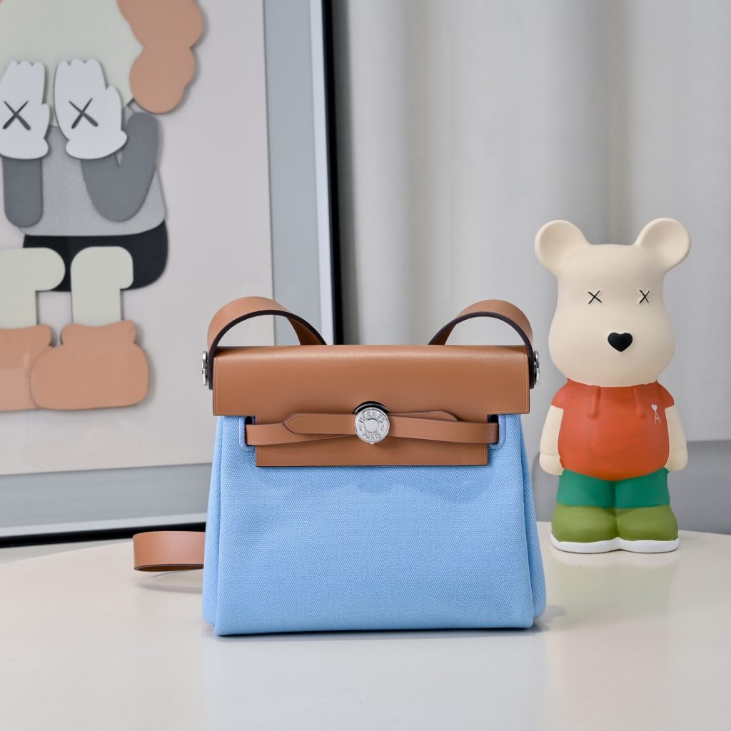 Mini Herbag — a canvas body with leather trim — Gold-tone or silver-tone hardware