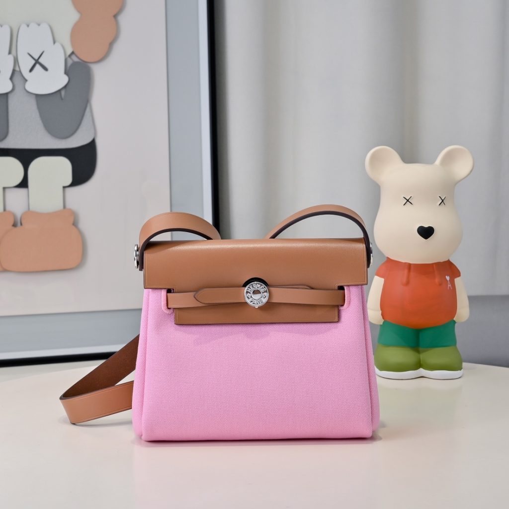 Mini Herbag — a canvas body with leather trim — Gold-tone or silver-tone hardware