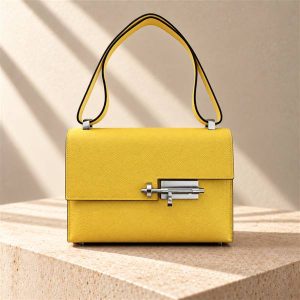 Hermès Verrou handbag on a warm ivory limestone surface